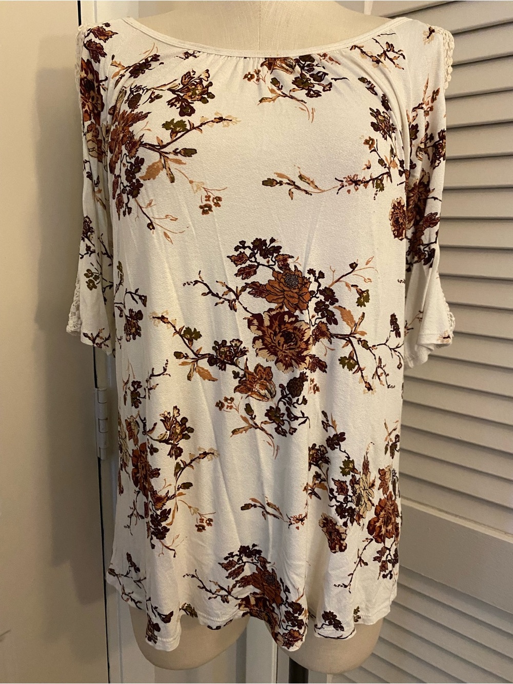 “Maurices” Cold Shoulder Cream Top with Brown Floral Accents- Size Small